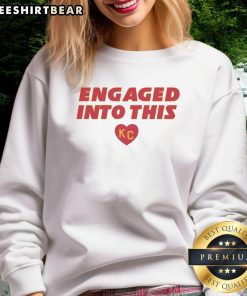 Official engaged sweatshirt featuring KC Travis Kelce and Taylor designs, perfect for fans celebrating their love.