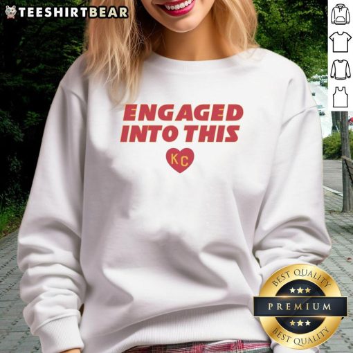 Official engaged sweatshirt featuring KC Travis Kelce and Taylor designs, perfect for fans celebrating their love.