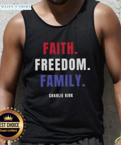 Charlie Kirk wearing an Official Faith Freedom Family tank top at a public event, promoting conservative values.
