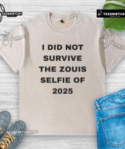 Official I Did Not Survive The Zouis Selfie of 2025 washed t-shirt displayed on a hanger in a trendy boutique.