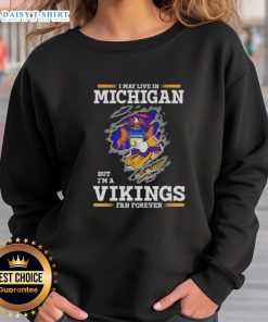Cozy sweatshirt featuring 'I May Live in Michigan But I'm a Minnesota Vikings Fan Forever' design, perfect for Vikings fans.