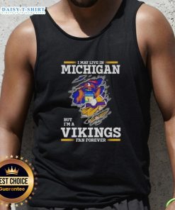 Official I May Live In Michigan But I'm A Minnesota Vikings Fan Forever tank top in vibrant purple and gold design.