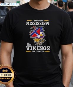 Alt Text: Official I May Live In Mississippi But I'M A Minnesota Vikings Fan Forever T-Shirt featuring bold team graphics.