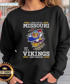 Official I May Live In Missouri But I'm A Minnesota Vikings Fan Forever sweatshirt featuring team colors and logo.