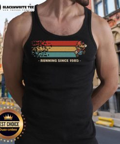 Alt Text: Retro gamer tank top featuring Official Mario Running Since 1985 design, perfect for gaming enthusiasts.