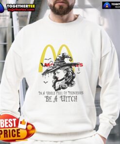 Official McDonald's Halloween sweatshirt featuring 'In a World Full of Princesses, Be a Witch' design for festive style.
