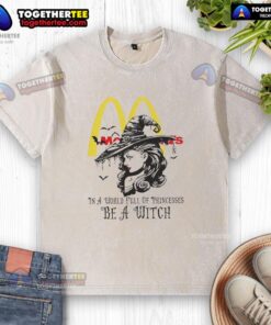 Official McDonald's 'In A World Full of Princesses, Be A Witch' Halloween washed t-shirt featuring playful witch design.