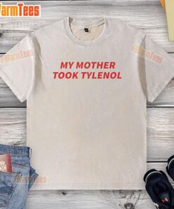 Official My Mother Took Tylenol washed t-shirt displayed on a hanger, showcasing humorous text design and soft fabric.