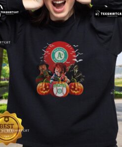 Official Oakland Athletics MLB Horror Movie Halloween Sweatshirt featuring spooky graphics and team colors.