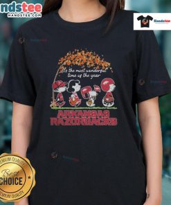 Official Peanuts characters and Arkansas Razorbacks NFL graphic on a ladies tee for the holiday season.