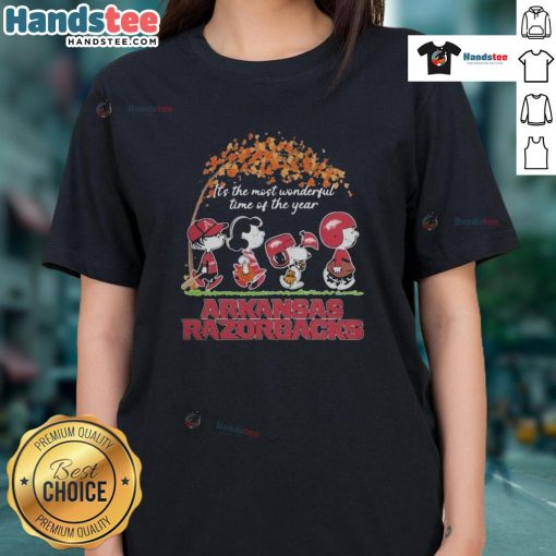 Official Peanuts characters and Arkansas Razorbacks NFL graphic on a ladies tee for the holiday season.