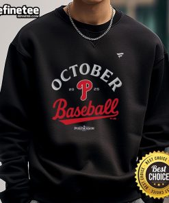 Alt Text: Official Philadelphia Phillies October Baseball 2025 MLB Postseason locker room sweatshirt displayed on a hanger.