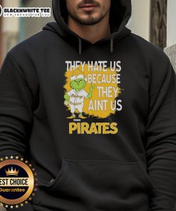 Official Pittsburgh Pirates Grinch Christmas hoodie featuring 'They Hate Us Ain't Us' design for festive fans.