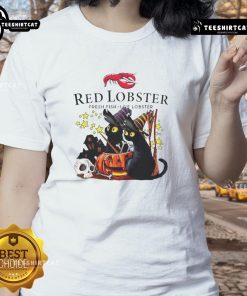 Alt Text: Official Red Lobster Halloween tee featuring a black cat, pumpkin, and haunted house design for ladies.