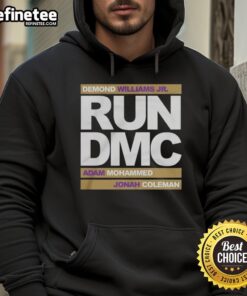Run DMC hoodie worn by Demond Williams Jr., Adam Mohammed, and Johnah Coleman at official football event.