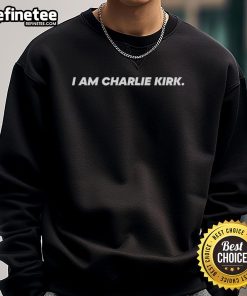 Charlie Kirk wearing the official 'I Am Charlie Kirk' sweatshirt during The Charlie Kirk Show event.