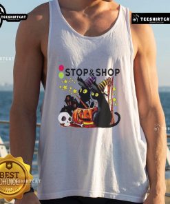 Alt Text: Black cat witch with pumpkin at a haunted house on a Halloween tank top from The Stop And Supermarket.