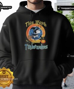 Official Snoopy Halloween hoodie featuring a witch design, celebrating Minnesota Timberwolves spirit and Halloween fun.