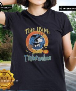 Alt Text: Official This Witch Loves The Minnesota Timberwolves Snoopy Halloween Ladies Tee featuring a fun witch and team logo.
