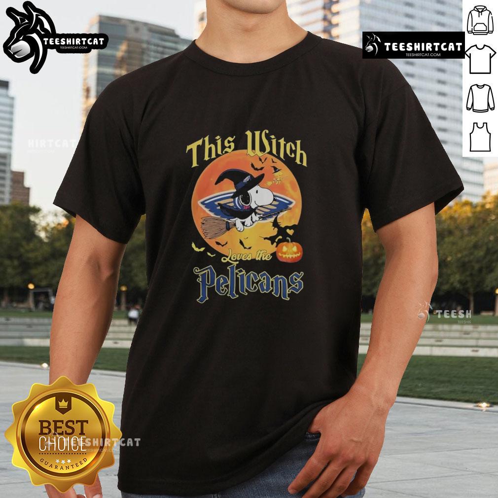 Official This Witch Loves The New Orleans Pelicans Snoopy Halloween T Shirt Alt Text: Official This Witch Loves The New Orleans Pelicans Snoopy Halloween T-Shirt featuring Snoopy in a witch costume.