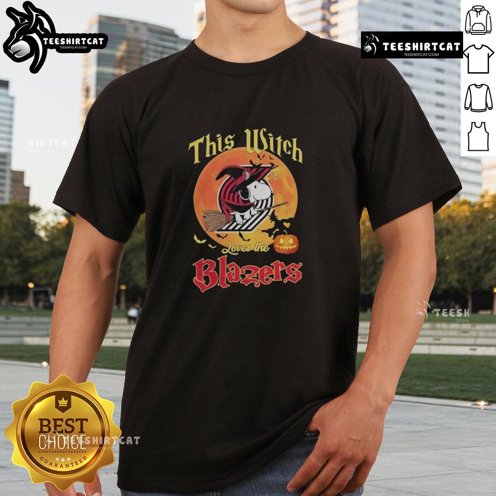 Official This Witch Loves The Portland Trail Blazers Snoopy Halloween T Shirt Alt Text: Official This Witch Loves The Portland Trail Blazers Snoopy Halloween T-Shirt featuring a playful design with Snoopy.