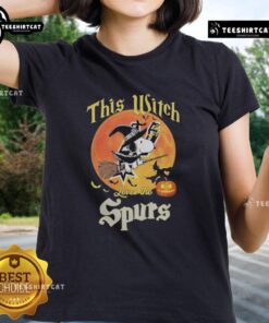 Official 'This Witch Loves the San Antonio Spurs' Snoopy Halloween Ladies Tee featuring a spooky design and team spirit.