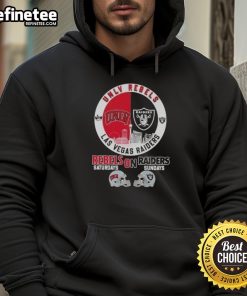 Alt Text: UNLV Rebels and Las Vegas Raiders football helmets featured on a stylish hoodie against a city skyline backdrop.