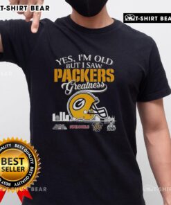 Alt Text: Official Yes Im Old But I Saw Green Bay Packers Greatness T-Shirt featuring Super Bowl helmet and city skyline design.