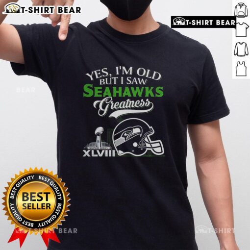 Alt Text: Yes Im Old But I Seattle Seahawks Greatness T-Shirt with Super Bowl helmet and city skyline design.