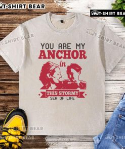 Official You Are My Anchor In This Stormy Sea Of Life washed T-shirt displayed on a wooden background.
