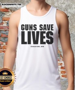 Charlie Kirk wearing a 'Guns Save Lives' tank top at a 2018 event, promoting Second Amendment rights and conservative values.