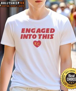 Original Engaged Into This KC Travis Kelce and Taylor T-Shirt featuring bold graphics celebrating the couple's engagement.