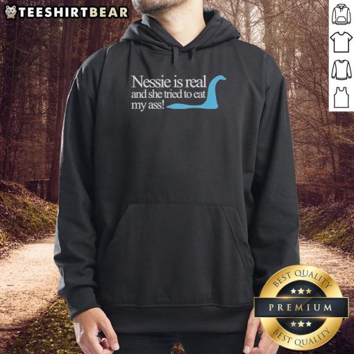 Original Loch Ness Nessie Is Real hoodie featuring a playful design of Nessie humorously attempting to eat.