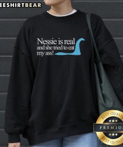 Original Loch Ness Nessie sweatshirt featuring humorous design about Nessie trying to eat my ass. Unique and fun apparel.