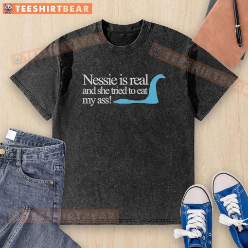 Funny 'Nessie is Real' T-shirt featuring Loch Ness Monster graphic, perfect for fans of Scotland's legendary creature.
