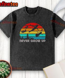Vintage washed t-shirt featuring an original Peter Pan silhouette with 'Never Grow Up' text design.