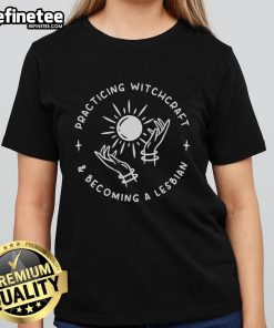 Original practicing witchcraft and becoming a lesbian ladies tee featuring a mystical design and empowering message.