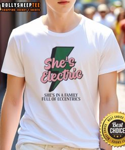 Alt Text: Original She'S Electric She'S In A Family Full Of Eccentrics T-Shirt design featuring vibrant colors and unique graphics.