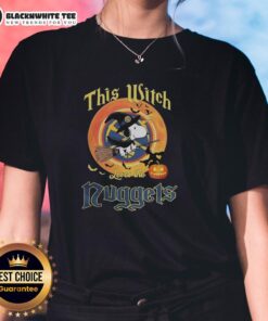 Original Snoopy Halloween tee featuring 'This Witch Loves The Denver Nuggets' design for women.