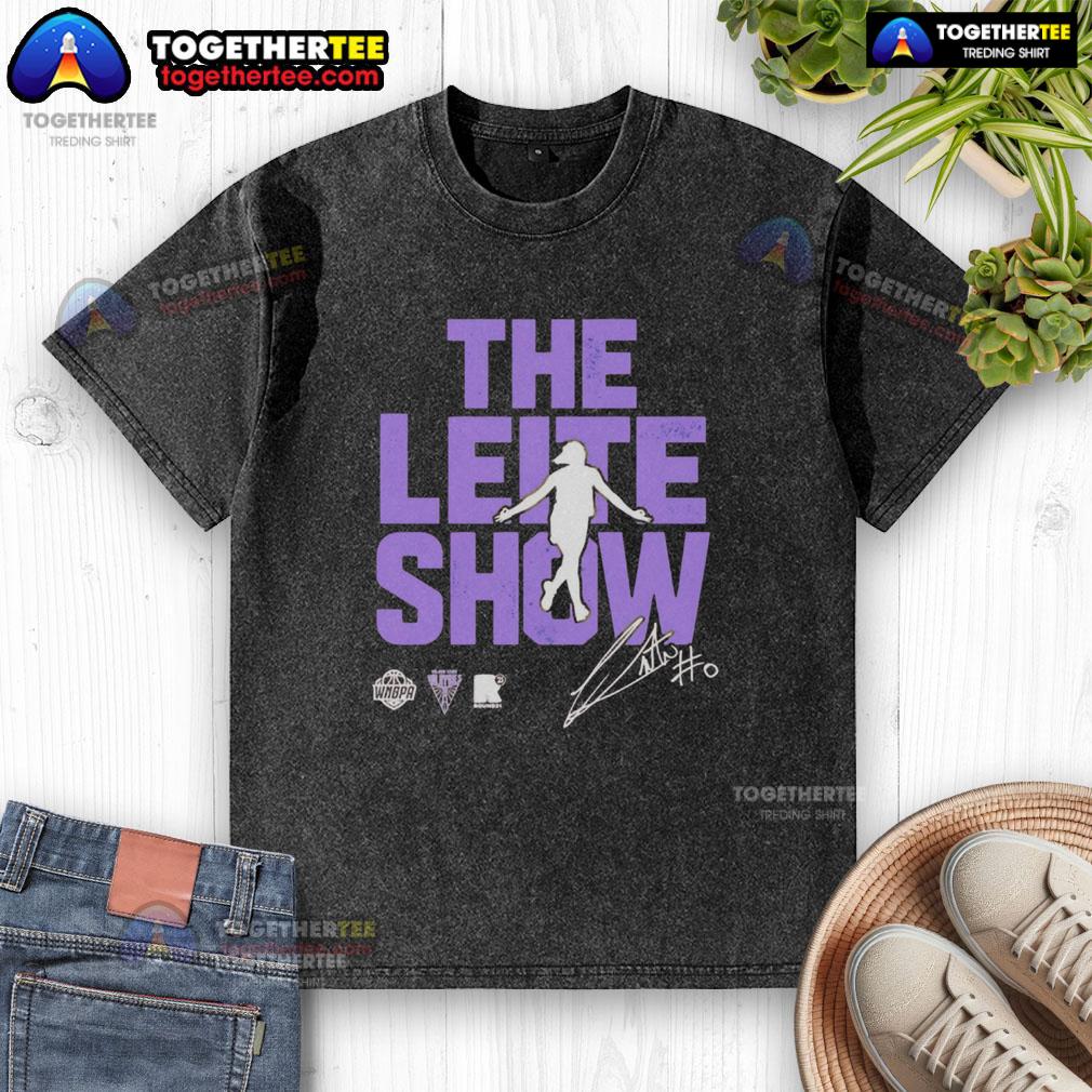 Original The Leite Show Carla Leite Golden State Valkyries Washed T Shirt Carla Leite wearing a stylish Golden State Valkyries washed t-shirt during The Leite Show, showcasing a trendy casual look.