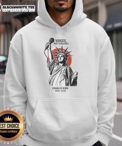 Alt Text: Charlie Kirk wearing a Original Voices Not Violence hoodie featuring the Statue of Liberty, 1993-2025.
