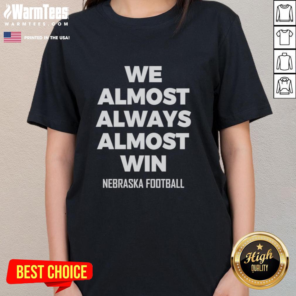 Original We Almost Always Almost Win Nebraska Football Ladies Tee Original We Almost Always Almost Win Nebraska Football Ladies Tee in red, showcasing team spirit and style for female fans.