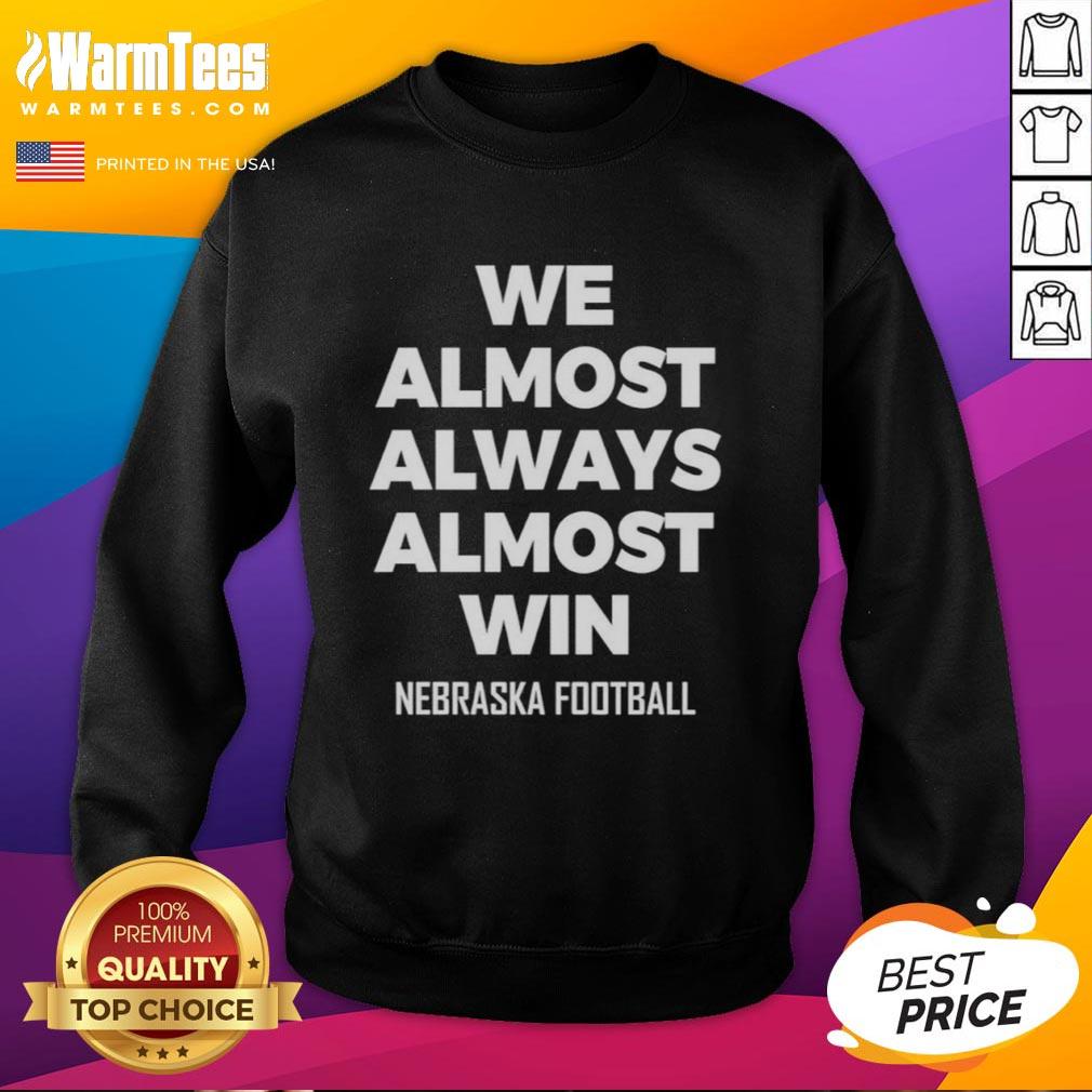 Original We Almost Always Almost Win Nebraska Football Sweatshirt Original We Almost Always Almost Win Nebraska Football Sweatshirt in red, featuring bold white lettering and a cozy design.