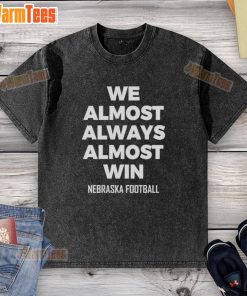 Original We Almost Always Almost Win Nebraska Football washed t-shirt featuring a vintage design and team colors.