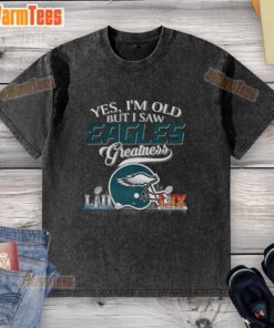 Alt Text: Philadelphia Eagles Super Bowl helmet skyline graphic on a washed t-shirt, perfect for proud fans and vintage style.
