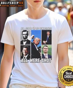 Premium Charlie Kirk T-Shirt featuring 'All Stood Up To Democrats, All Were Shot' design for political statement wear.