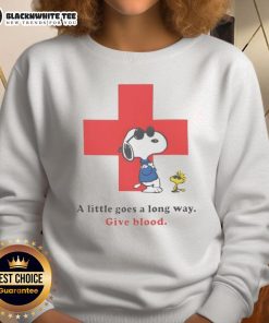 Alt Text: Premium American Red Cross Snoopy sweatshirt featuring A Little Goes A Long Way slogan, perfect for blood donation supporters.