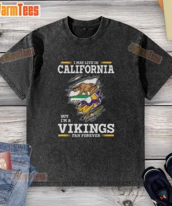 Alt Text: Premium washed t-shirt featuring I may live in California but I'm a Minnesota Vikings fan forever design.