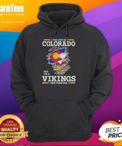Premium hoodie for Minnesota Vikings fans, featuring 'I May Live In Colorado But I'm A Minnesota Vikings Fan Forever' design.