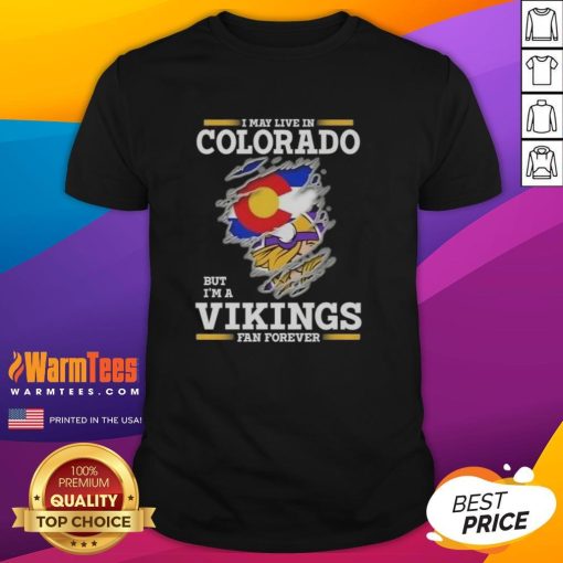 Alt Text: Premium I May Live In Colorado But I'm A Minnesota Vikings Fan Forever T-Shirt, showcasing team pride and style.